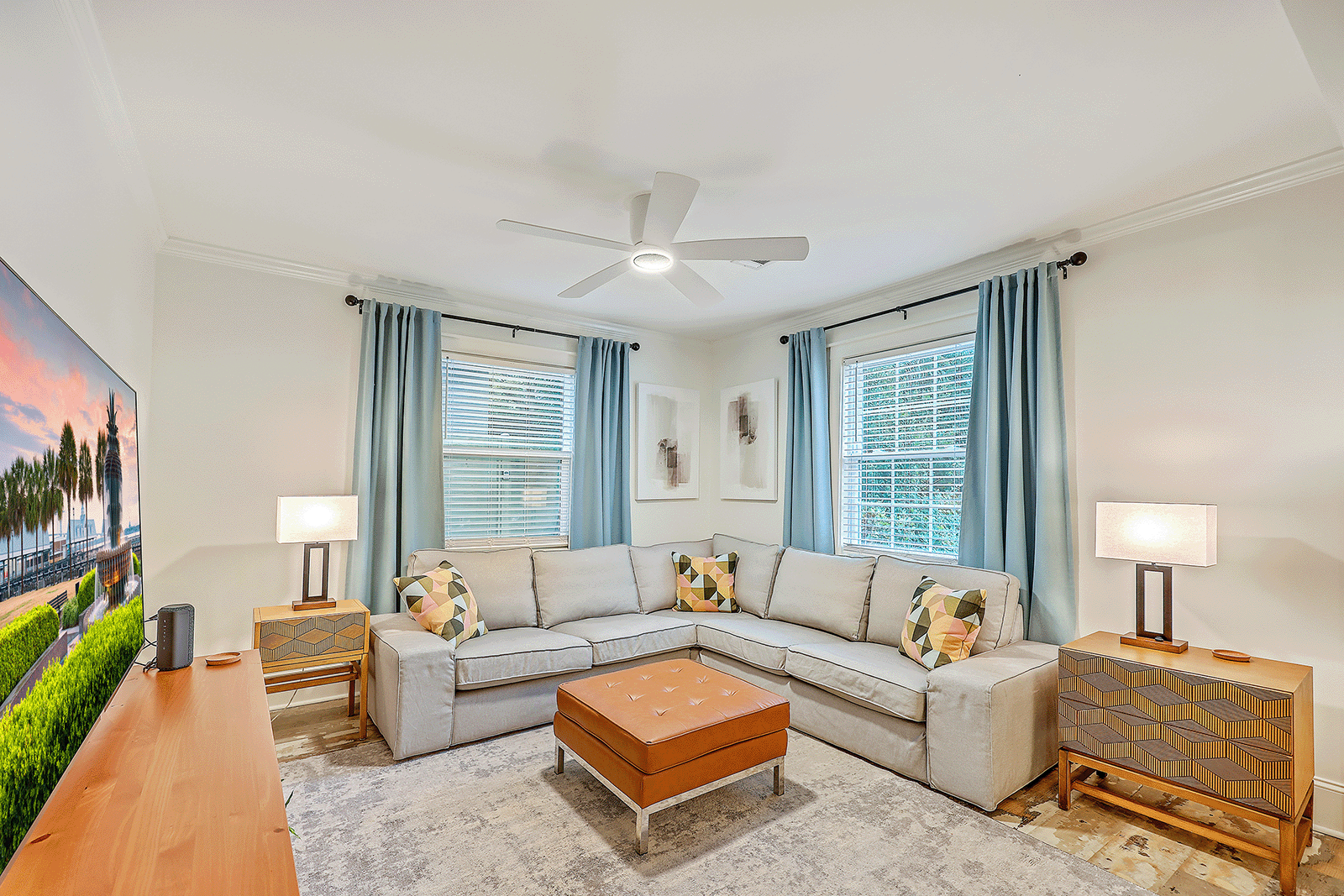 Photo of a living room Photo of a Cottage living room with furniture, a ceiling fan and a television in CorpComfort