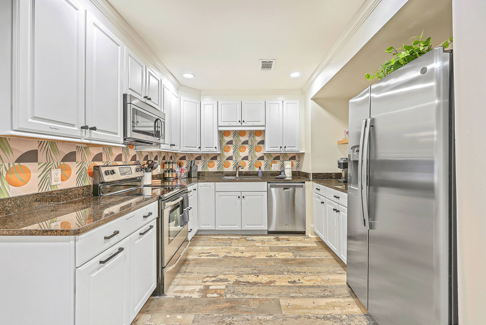 Larger image of a kitchen Larger image of a kitchen where you can see a refrigerator